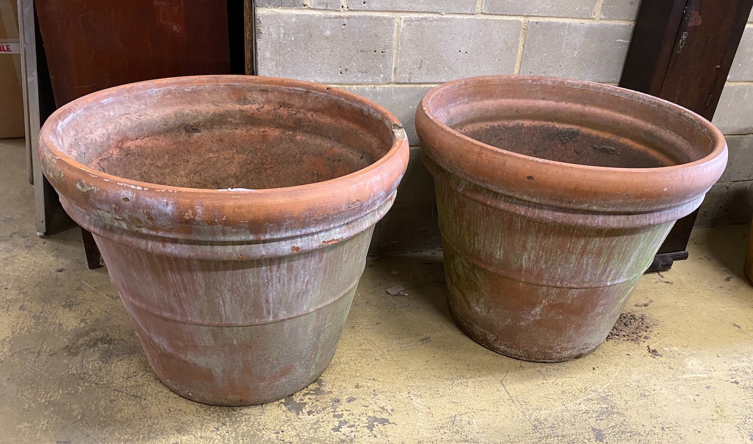 A pair of large circular Italian terracotta garden planters, diameter 89cm, height 72cm